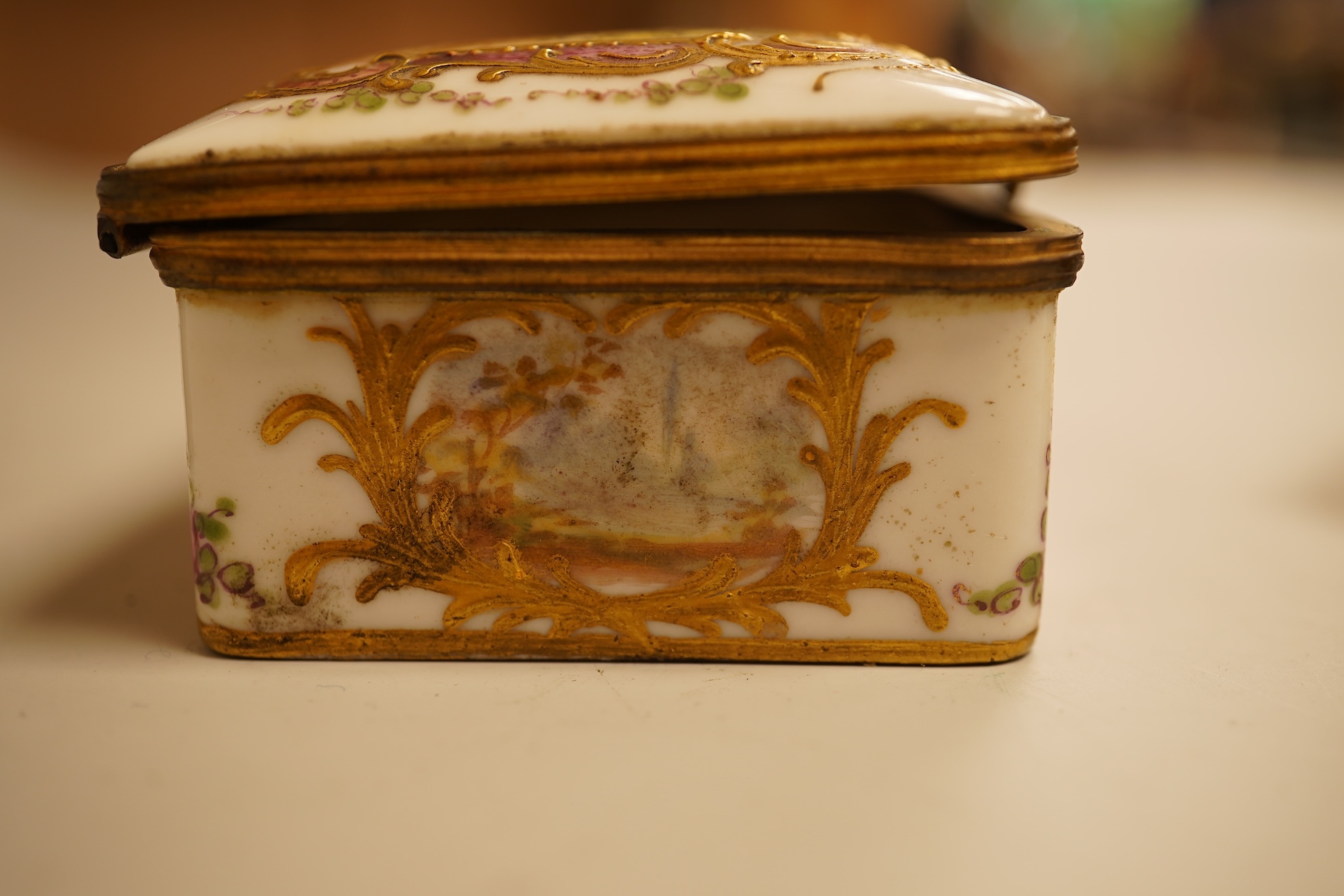 A Zsolnay lustre 'chicken' box and cover and two Sevres style porcelain boxes and covers (3) ‘chicken box’ 5cm diameter.